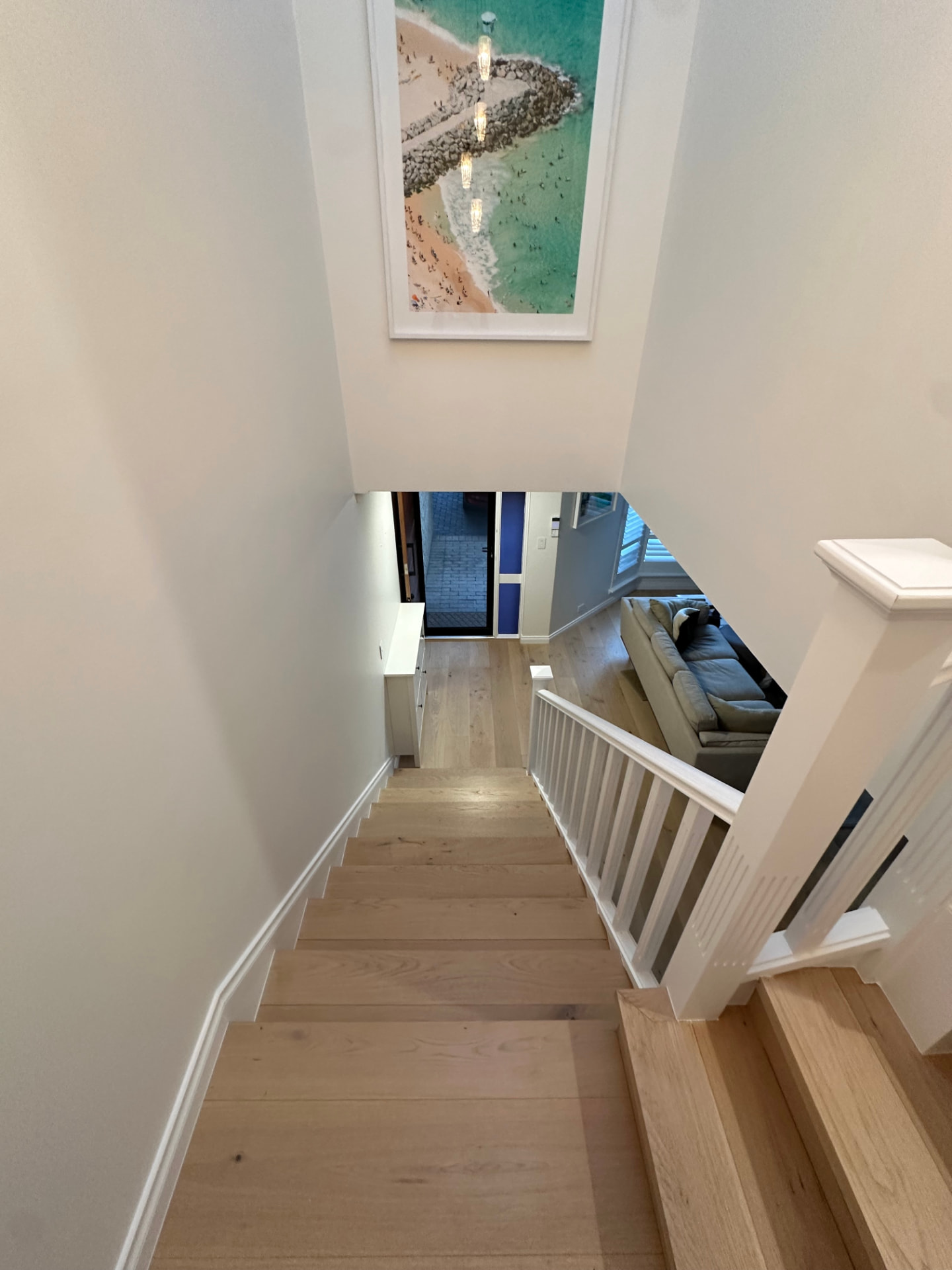 Staircase, balustrade and walls repainted with white trim