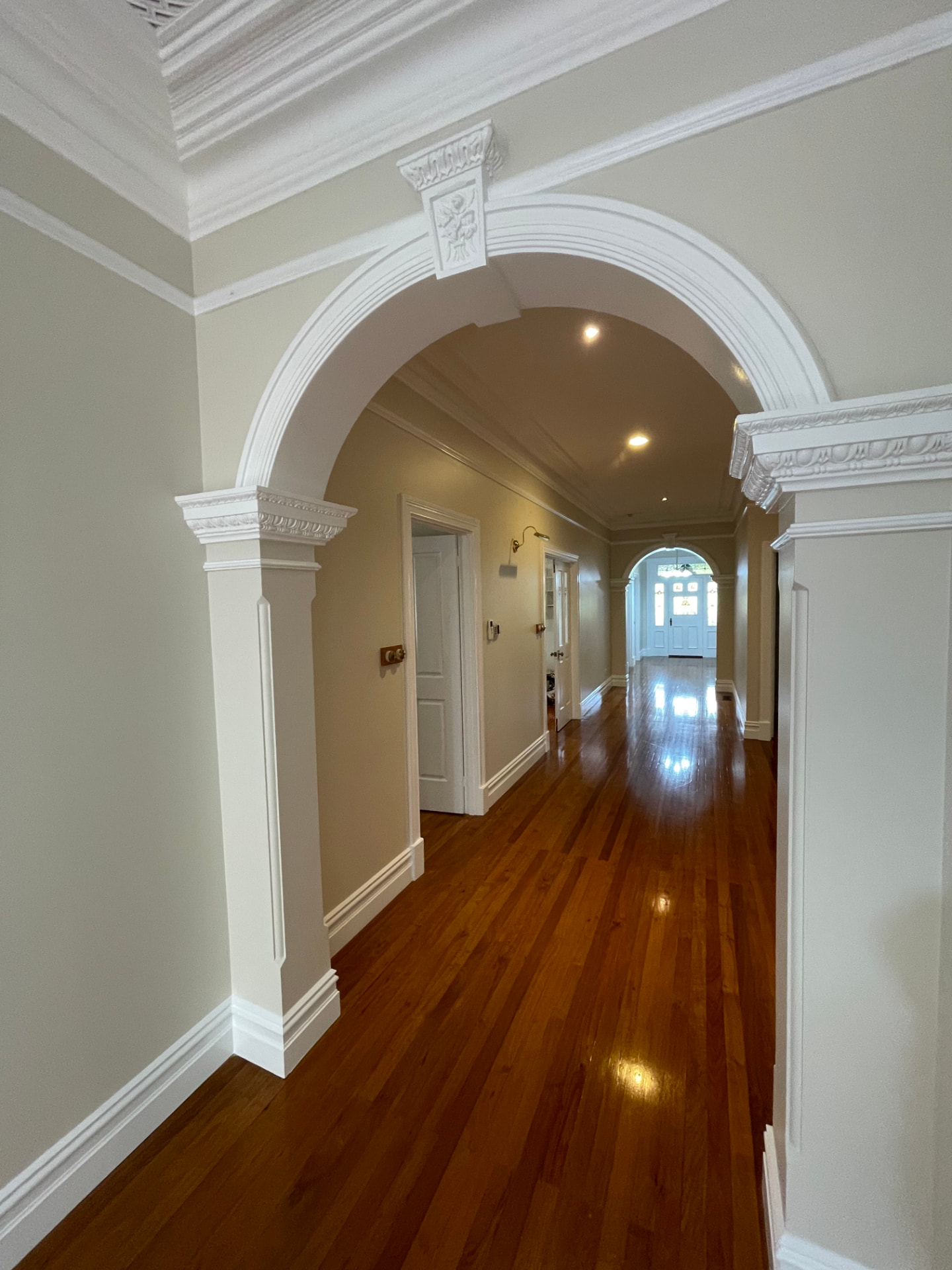 Freshly painted interior hallway with detailed cornices in a Perth home